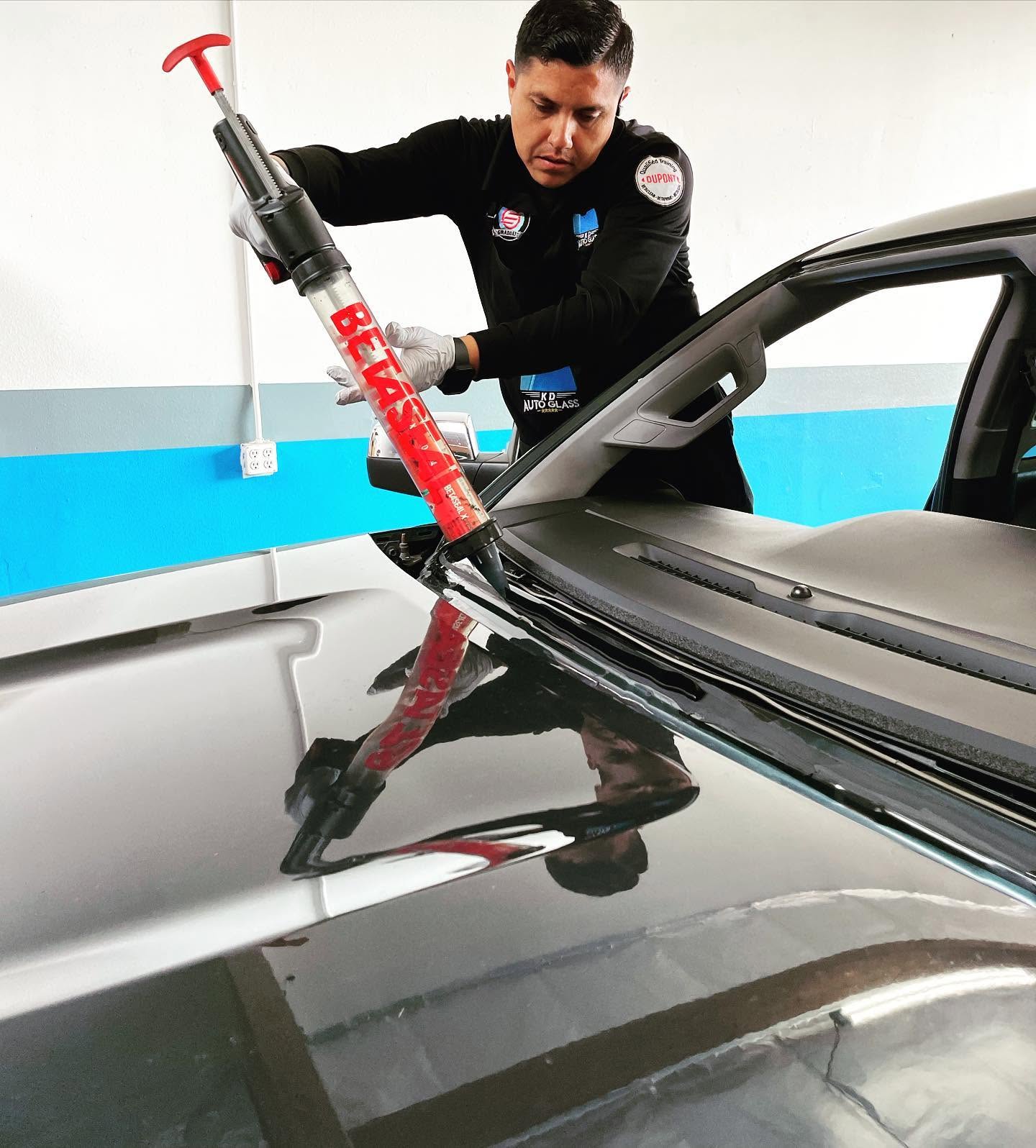 KD Auto Glass team working on a vehicle